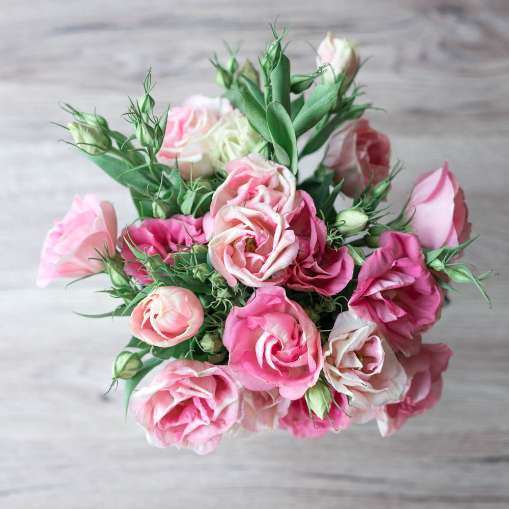 Beautiful pink flower bouquet on a table from the high angle