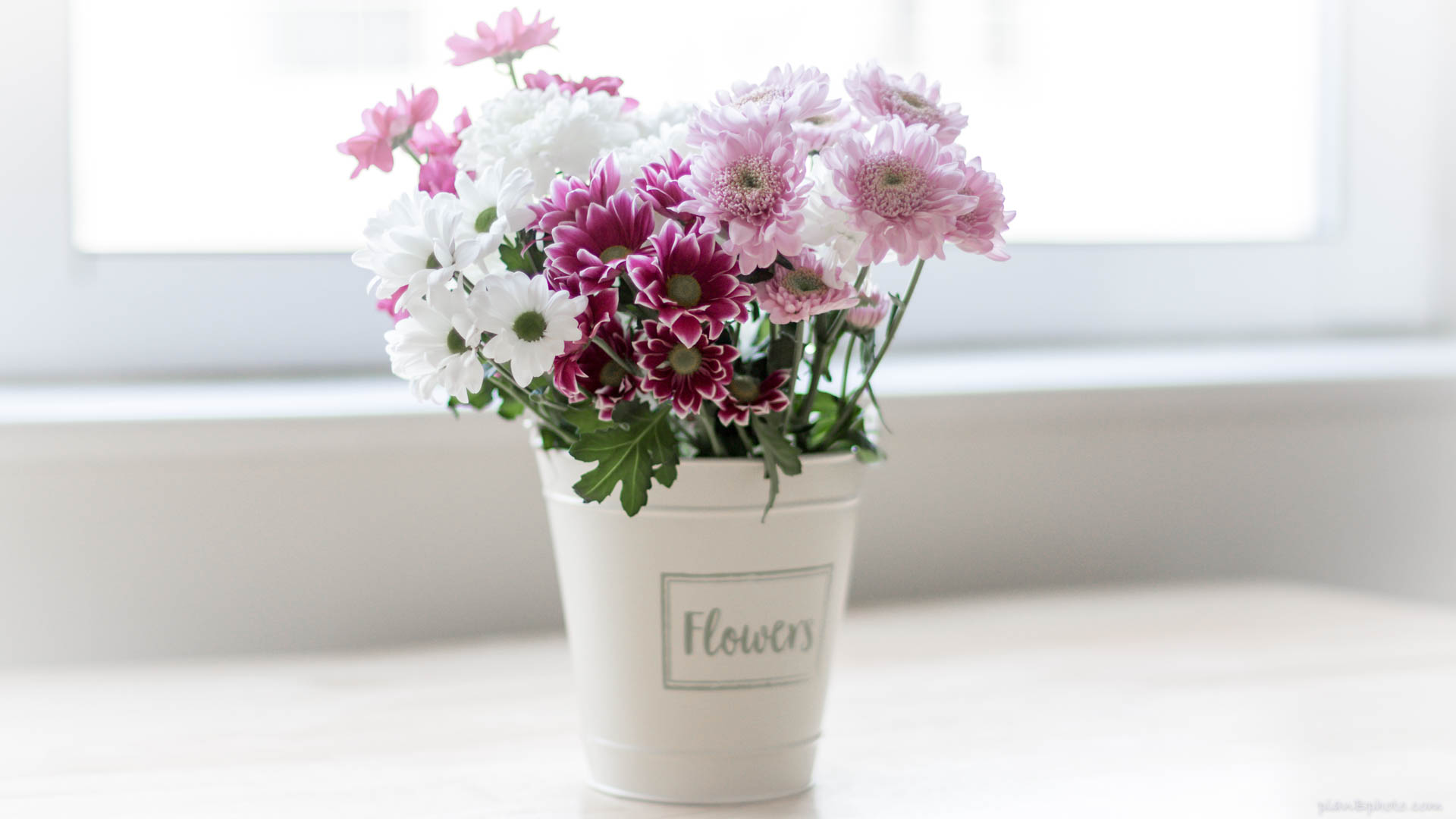 Flower bouquet in a white bucket