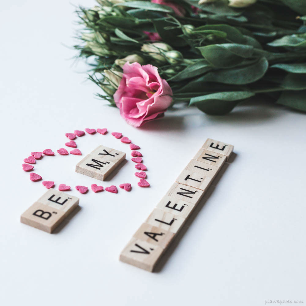 Be mine letters with pink flowers and a heart. Valentine's image.