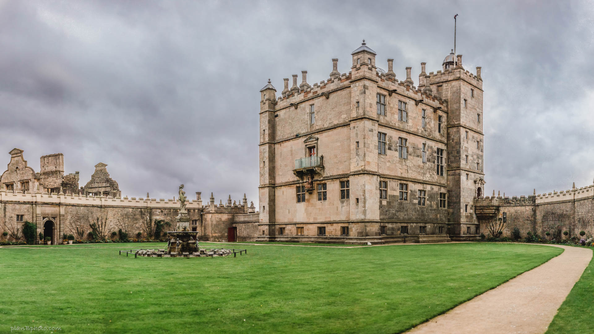 Image of Bolsover castle with dark clouds around