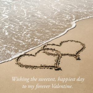 happiest valentines day wish with two hearts drawn on the sand
