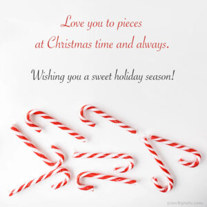 Love you to pieces Christmas wish with red candy cones on a white background