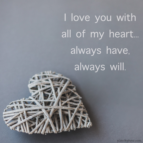 Rustic heart on grey background with love quote