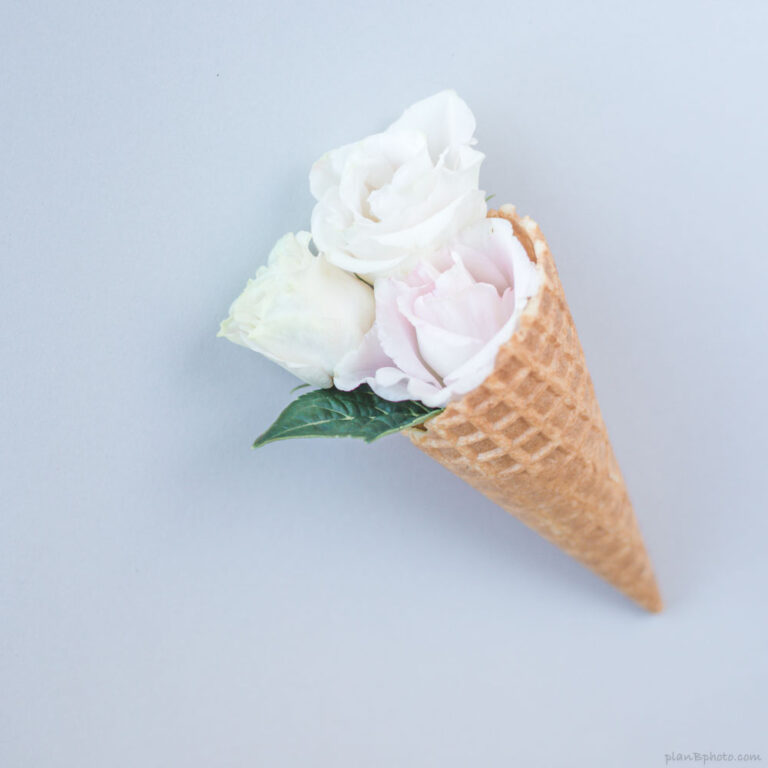 Waffle ice cream cone with white roses